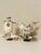 Pair of Vintage Shell Sailboat Folk Art Sculptures A charming pair of vintage handcrafted shell sailboats featuring...