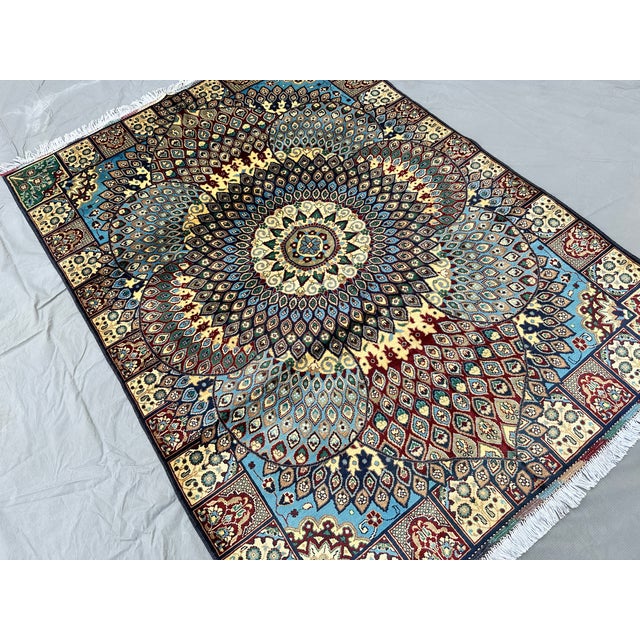A finely hand-knotted Afghan rug in the celebrated Gonbad ("dome") design — the field renders the interior of an ancient...