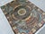 A finely hand-knotted Afghan rug in the celebrated Gonbad ("dome") design — the field renders the interior of an ancient...