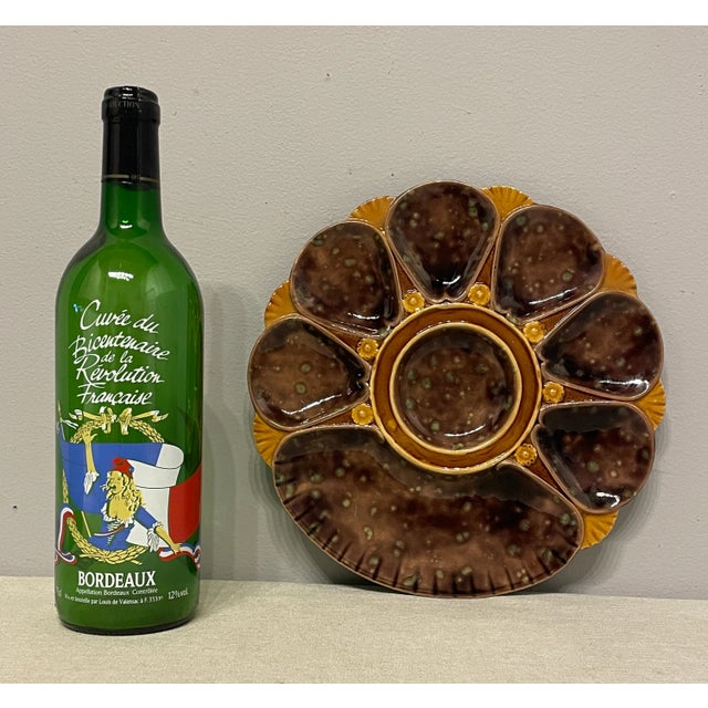 A good 19th century English Majolica Oyster Plate, unusual brown color, with green back. Marks on the back 2239. The plate...