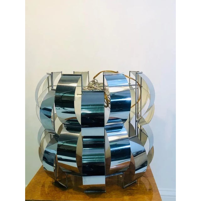 Curtis Jere hanging chandelier. Chrome with great design. 1970’s. Measures 16” diameter, 15 1/2” high. In good condition.