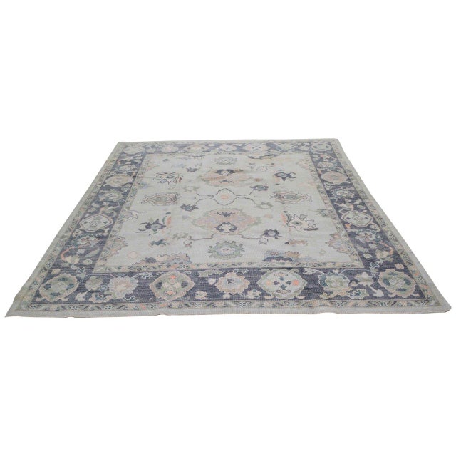 Hand-knotted with care using traditional rug-making techniques, this wool rug blends timeless craftsmanship with a modern...