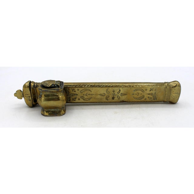 Circa 1850 Middle Eastern Islamic brass inkwell & pen case (Qalamden). Solid brass with cast parts. The case's sides are...