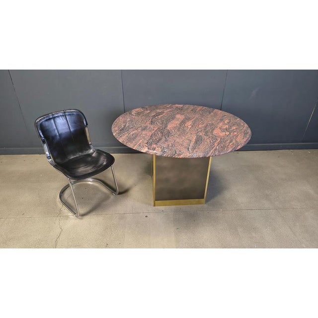 Vintage granite dining table with a brass base by Belgochrom Beautiful stone pattern in the table top. Good condition....