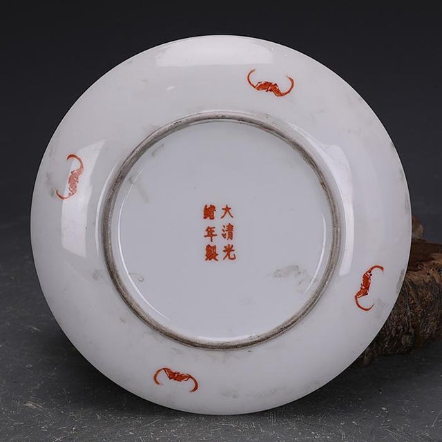 Add a touch of traditional Asian artistry to your space with this vintage porcelain plate. This decorative dish features a...
