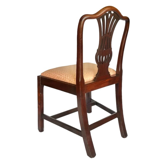 A fine circa 1780 Georgian side chair in mahogany with rich patina and wonderful silhouette. The substantial vasiform...