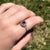 This unique ring features a natural earth mined Ceylon blue sapphire complimented by a double halo of 2 sizes of natural...