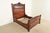 An outstanding antique Eastlake Victorian carved walnut and burl wood queen size bed frame In the manner of Herter...
