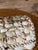 A beautiful vintage handcrafted shell-covered keepsake box showcasing an intricate mosaic of natural seashells in a...
