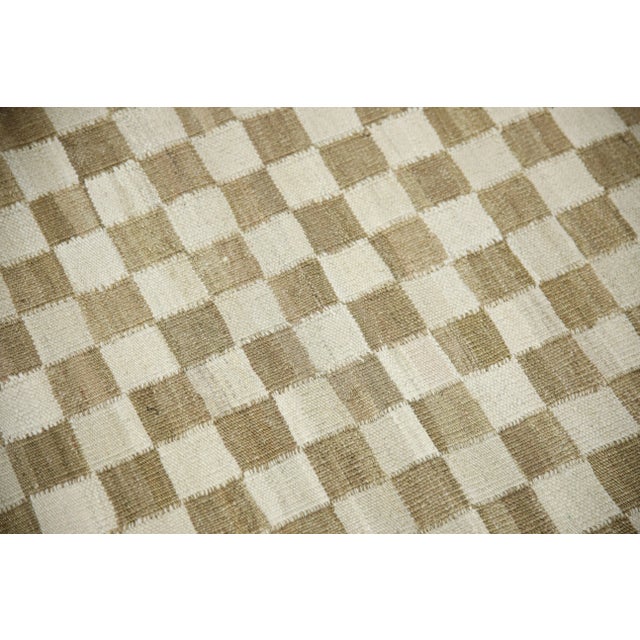 This exquisite Turkish flatweave kilim rug is a stunning masterpiece of traditional craftsmanship. Each rug is...