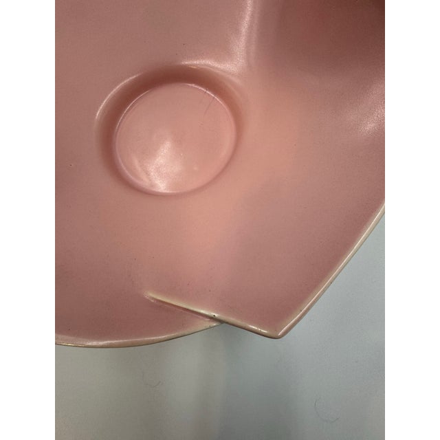 A beautiful vintage mid-century art pottery bowl featuring a softly sculptural, organic form with gently undulating edges....