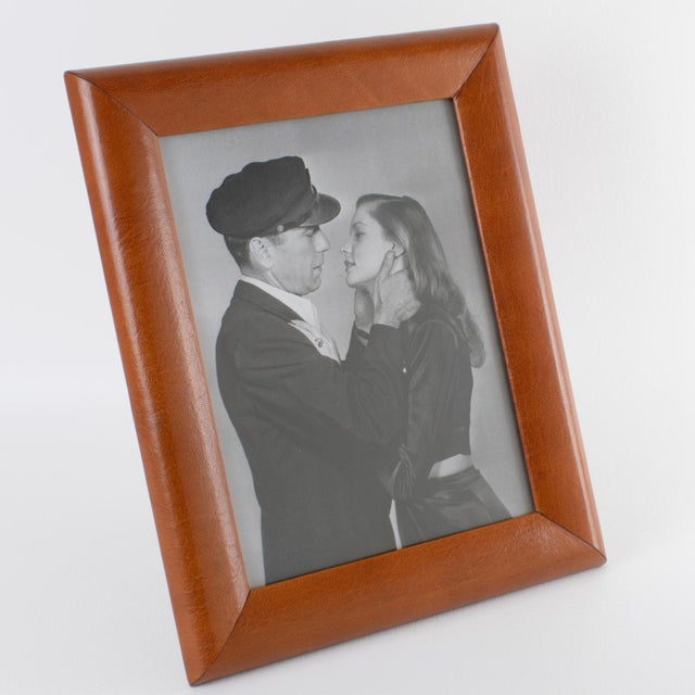 This luxury modernist leather picture frame was expertly crafted in England circa 1970. The piece features fine-grain calf...