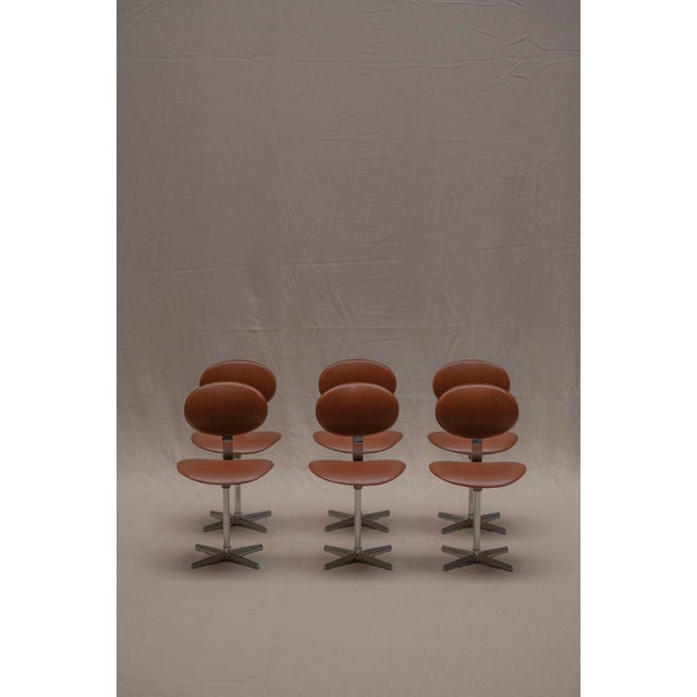 Produced in 1969 by Beaufort, this playful set of dining chairs embodies the spirit of the Space Age era. Each chair...