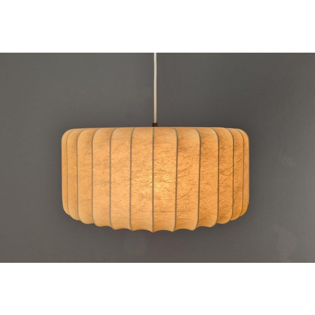 Beautiful mid-century classic in the form of a Cocoon lamp from Goldkant. Design by Friedel Wauer, 1960s. The principle of...