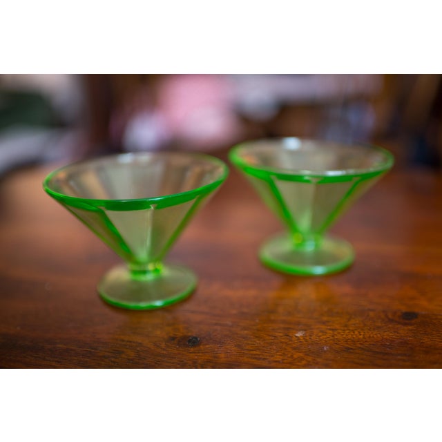 This pair of depression Vaseline glass low footed sherbet champagne glasses were made by the Federal Glass Co. and they...