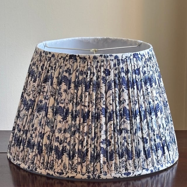 A large and very elegant vintage lampshade featuring a blue and antique white Jacobean floral chintz-style fabric with an...