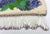 Micro-beaded floral tapestry purse, circa 1920s. The frame set with marcasites (2 lacking). Beading in fine condition....