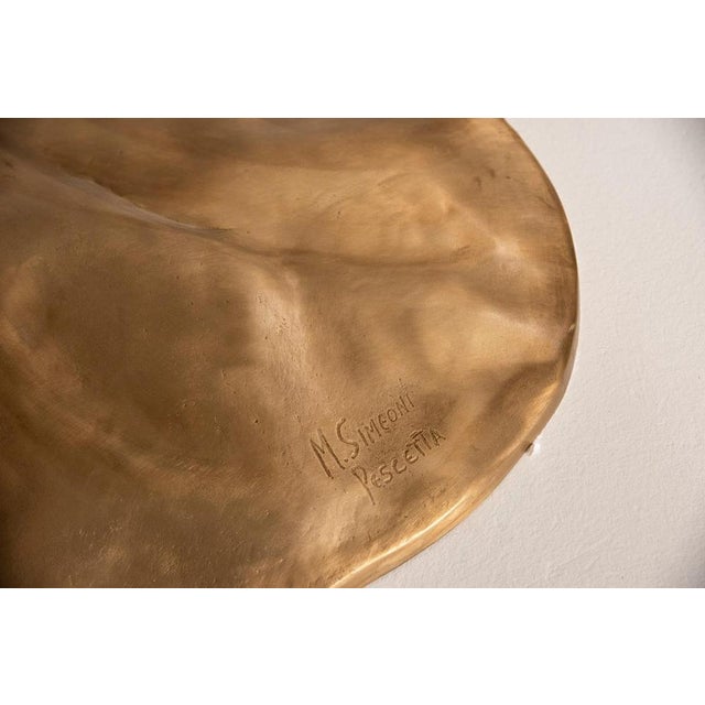 Pescetta sculpture table, a unique work of design and material, handcrafted entirely in Italy. The table has a central leg...