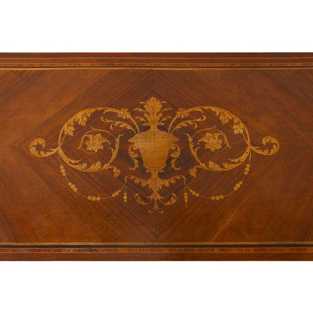 A late 19th-century louis xvi-style chest of drawers, veneered with various types of wood: walnut, boxwood, rosewood, and...