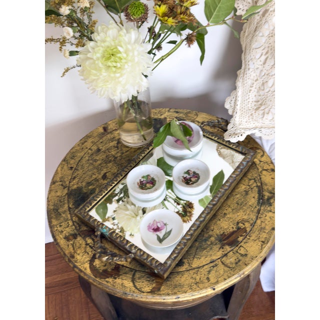 Vintage rectangular mirrored vanity tray, made in Denmark. Features a mirrored glass base set in an ornate brass frame...
