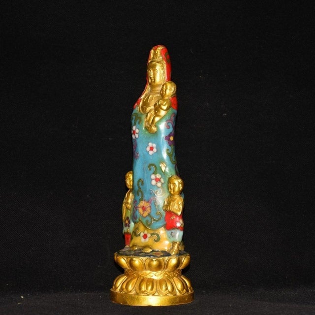 Ornate cloisonne gilt sculpture depicting Guanyin with children, crafted on a lotus pedestal. Handmade with copper base...