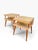A stylish pair of vintage Mid-Century Modern two-tier end tables with a clean, architectural profile and warm natural wood...