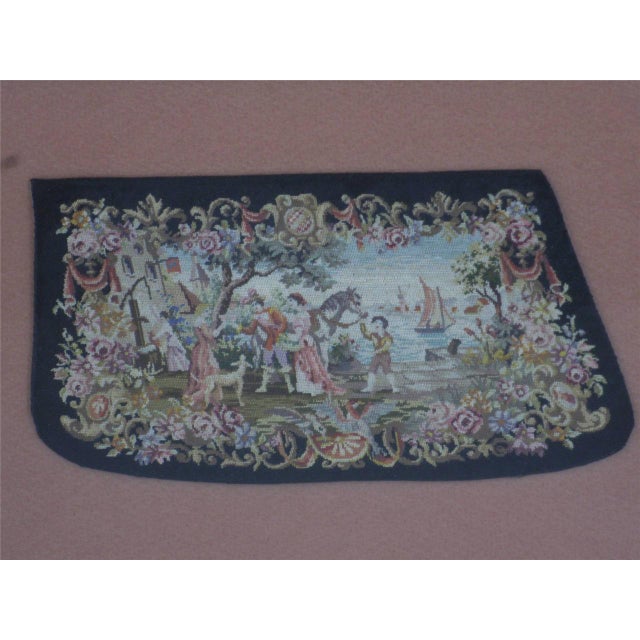 This product is a rare antique needlepoint sleeve cuff; 4" X 7" hand embroidered on cloth and framed in a luxurious gold...