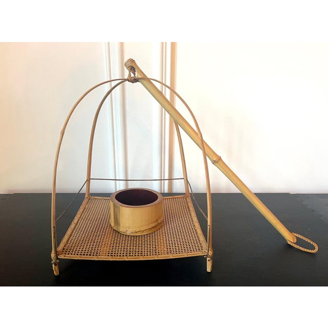 A rare hanging ikebana basket by Japanese bamboo artist Suzuki Gengensai (1891-1950) circa 1923-50. This elegant hanakago...