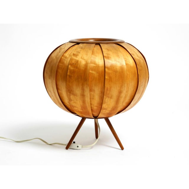 Large 1960s wood veneer tripod lamp on wooden legs. the entire shade is made of oiled birch veneer. designed by the well-...