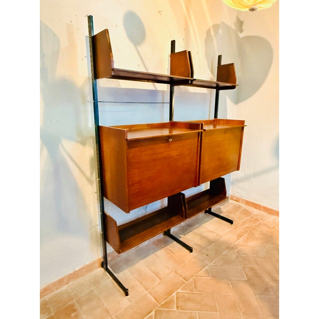 Modular bookcase with two closed boxes, one of which functions as a desk, produced in the 60s by mim and designed by ico...