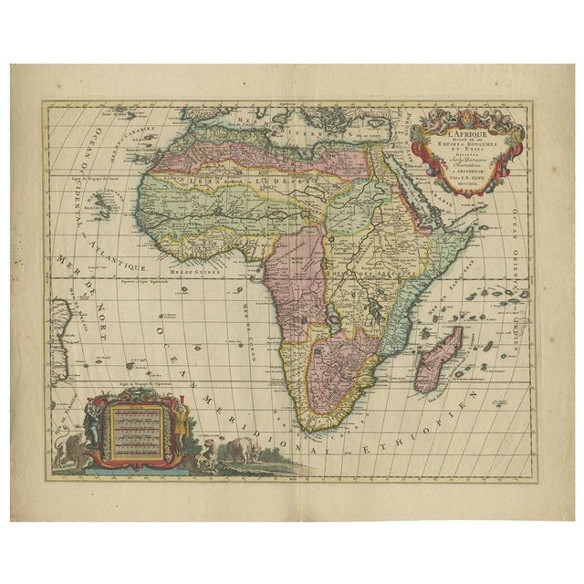 Antique map titled 'l'Afrique Divisée en ses Empires, Royaumes, et Etats'. Decorative large map of Africa. The cartography...
