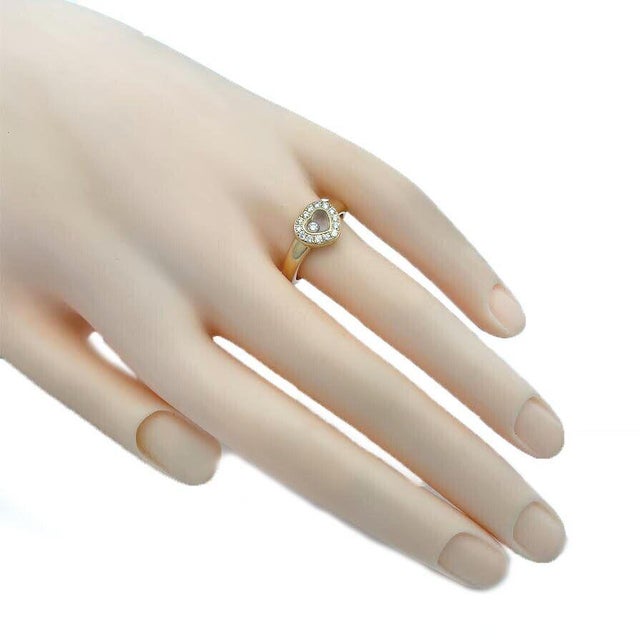 This is lovely and elegant authentic designer ring by Chopard, from the Happy Diamond Collection. It is beautifully...