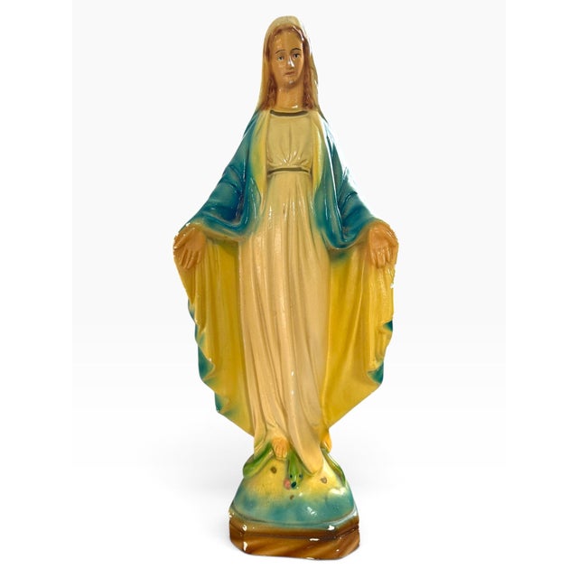 Striking vintage ceramic devotional figure depicting the Virgin Mary in a graceful standing pose, with her hands extended...