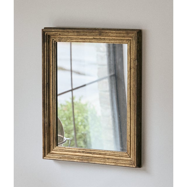 Italian gilt mirror, dating back to the 19th Century. The mirror itself has been replaced over time, but the gilt frame is...