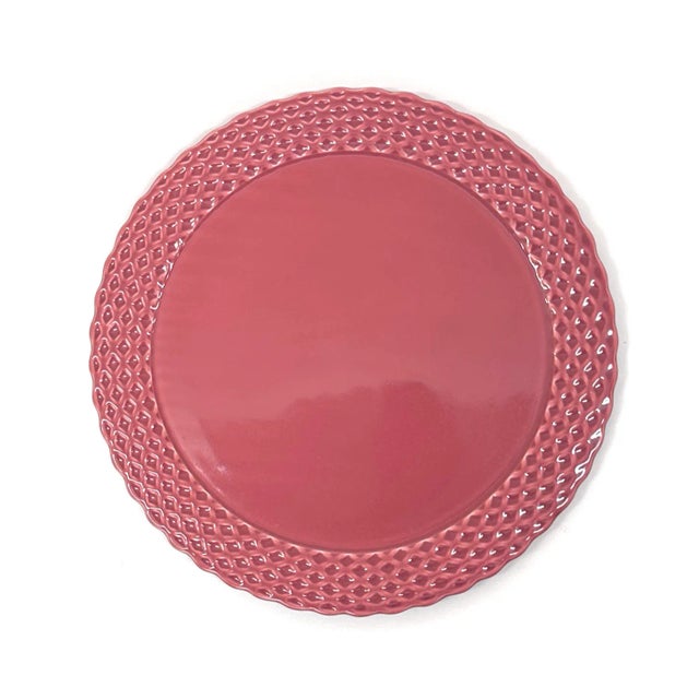 Mixed rose pink decorative plates, group of 9. A glamorous group of monochromatic decorative plates that comes in a...