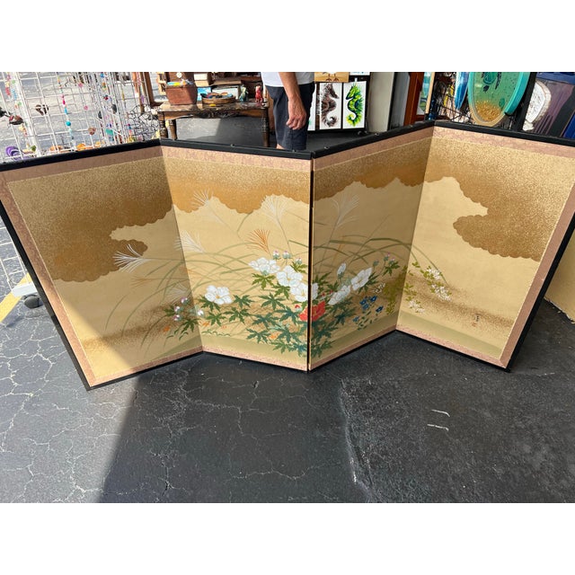 This is a Japanese four-panel byobu folding screen featuring a floral and landscape design. The screen is consistent with...