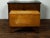 An American maple drop-leaf table from the 19th century, with tapered legs. Made in the USA during the 19th century, this...