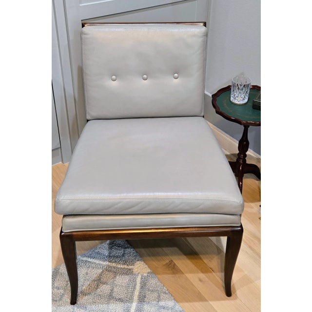 his stunning Mid-Century Modern slipper chair by Global Views, Dallas, Texas, combines timeless sophistication with...