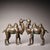 This is a matching pair of cast bronze Bactrian camel figurines, featuring extensive gold and silver inlay decoration....