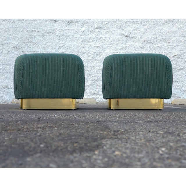 Nice pair of 1980s square pouf ottomans with brass plith bases. Ottomans are in good condition overall showing light wear....