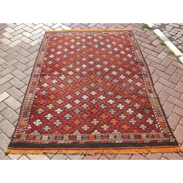 This beautiful, vintage, handwoven kilim is approximately 60 years old. It is handmade of very fine quality wool in all...