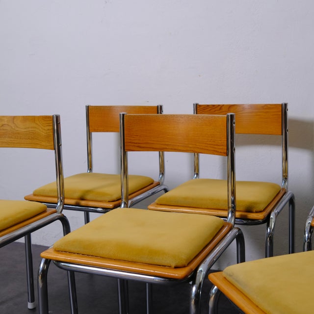 Beautiful set of 6 Ibisco chairs, crafted from wood, metal, and cane. These chairs feature a chromed tubular frame with a...