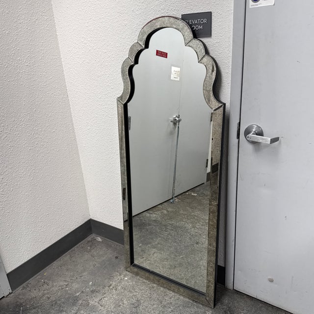 Design Plus Gallery presents a Lunel Arch Mirror by Jim Parsons from Uttermost. The mirror showcases an elongated...