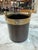 Vintage Italian champagne/wine ice buckets featuring elegant black cylindrical bodies with solid brass rims and integrated...