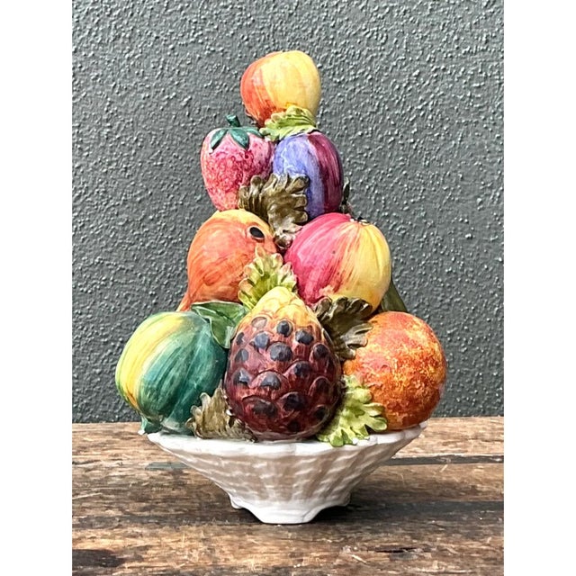 This vintage Italian ceramic fruit topiary rises in a sculptural pyramid, with brightly glazed fruits stacked in tiers...