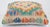 A one-of-a-kind handwoven Afghan wool kilim accent pillow featuring radiant diamond medallion in orange, teal and green....