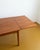 Vintage 1960s Danish teak table with two butterfly extension leaves, an elegant design with rounded corners, perfect for...