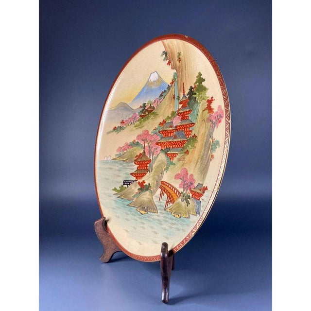 Japanese "Satsuma" plate from the late Meiji period (1868-1912). A nicely detailed Japanese Satsuma ware slightly dished...