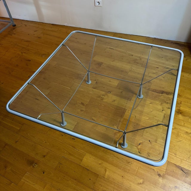 Superb coffee table by Niels Bendtsen, made in Denmark in the 70s. Gray lacquered tubular steel structure, glass top. In...