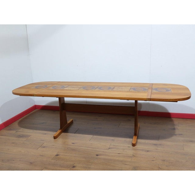 This Mid Century Modern Vintage Teak and Danish extending dining table by Ansager exemplifies the impeccable craftsmanship...